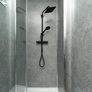 a shower with a shower head in a bathroom at Open Mind Property - Cozy 4BR Flat & 12 Guests in Littlehampton