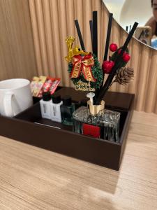 a black box with christmas decorations on a table at Abundant Eco Hostel in Laguna Phuket +36 photos