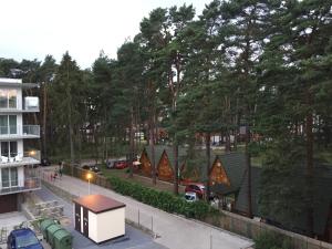 an aerial view of a group of houses with trees at MOHO apartament in Dziwnówek