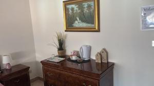 a room with a wooden dresser with a blender on it at B&B Altea in Pescara