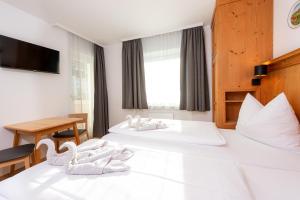 Postel nebo postele na pokoji v ubytování Chalet Georg