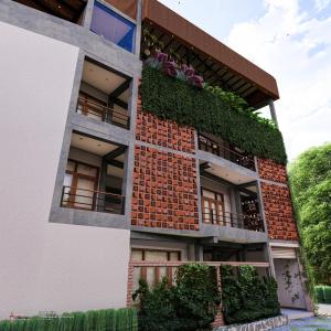 a building with ivy on the side of it at Blue Sky Villa 02 Ahangama in Ahangama