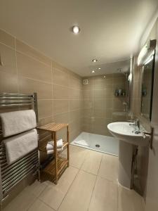 a bathroom with a sink and a shower and a tub at Craigatin House & Courtyard in Pitlochry +80 photos