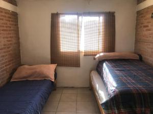 Postel nebo postele na pokoji v ubytování Casita El Mirador Trasla