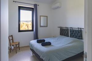 Ένα ή περισσότερα κρεβάτια σε δωμάτιο στο Gîte La Mosaïque