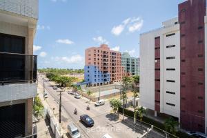 an aerial view of a city street with buildings at Sua estadia a 350m da Praia em prédio c/ piscina na melhor localização de Cabedelo-PB | PTAs in Ilha da Restinga