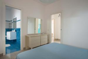 En eller flere senge i et værelse på Villetta San Leone con giardino