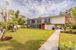 an exterior view of a house with a yard at Waterfront Home by Ralph Twitchell in Sarasota