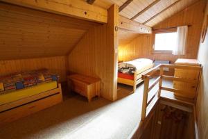 a small room with a bed in a cabin at Fewo Mit Blick Auf Die Berge in Sedrun