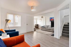 a living room with a couch and a table at Finest Retreats - Ffordd Y Meillion in Llanelli