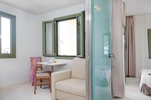 Ein Bett oder Betten in einem Zimmer der Unterkunft Aphrodite Samos Suites