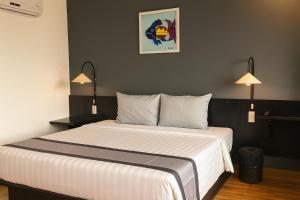 Postel nebo postele na pokoji v ubytování Sunset Hill Resort Phú Quốc