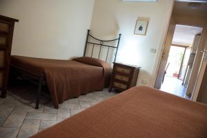 Postel nebo postele na pokoji v ubytování Bilocale Alborense + 8 fotografií