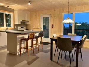 Η κουζίνα ή μικρή κουζίνα στο Le Nid - À travers les arbres