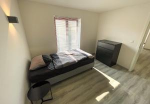 Postel nebo postele na pokoji v ubytování 78-4 - Luxe appartement met havenuitzicht + 2 fotografie