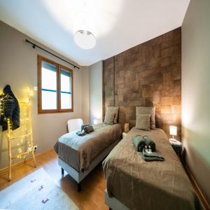 Ένα ή περισσότερα κρεβάτια σε δωμάτιο στο Chalet Le cocon plein sud