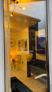 a room with a bathroom with a sink and a mirror at Irenic Luxury Rentals in Coventry