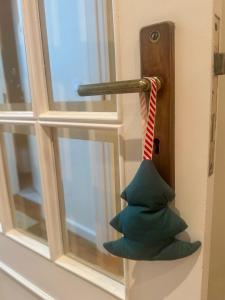 a door knob with a tie hanging from it at Serene Coastal Retreat with king Beds & Pool in Lavra in Lavra
