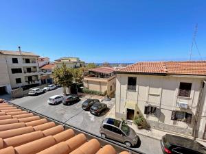 a view of a street with cars parked in a parking lot at Residenza Degli Dei in Tropea