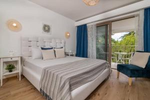 Postel nebo postele na pokoji v ubytování Villa Ionio Deste by Villa Plus