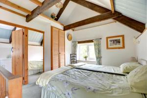 Ένα ή περισσότερα κρεβάτια σε δωμάτιο στο The Stables