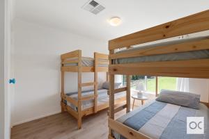 a bedroom with two bunk beds and a window at Amazing Views in Middleton