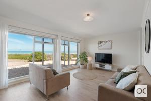 a living room with a couch and a television at Amazing Views in Middleton