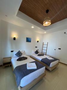 Postel nebo postele na pokoji v ubytování Ahiva Village