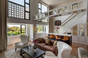 a living room with a couch and a table at Hotel Camiral - The Leading Hotels of the World in Caldes de Malavella