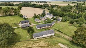 an aerial view of an estate with a group of buildings at Le Clos des Aulnes in Astillé