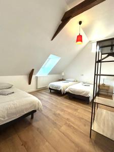 Ένα ή περισσότερα κρεβάτια σε δωμάτιο στο Le Clos des Aulnes +11 φωτογραφίες