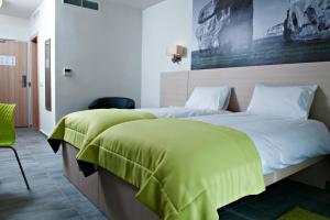 Postel nebo postele na pokoji v ubytování Hotel Santana