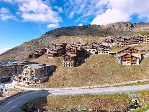 a village on the side of a hill at Studio Les Olympiades-28 by Interhome in Val Thorens