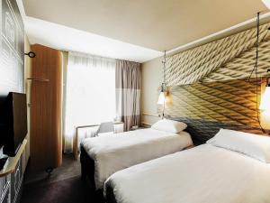 Postel nebo postele na pokoji v ubytování Ibis Poznan Polnoc + 102 fotografií