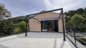 a building with awning on a patio with a view at Serena Terrace in Cabeceiras de Basto