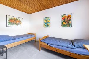 Postel nebo postele na pokoji v ubytování Gästehaus