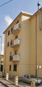 a building with a car parked in front of it at Love Gioia Tauro in Gioia Tauro