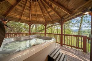 a hot tub on the deck of a gazebo at St Johns Ridge in Sugar Grove