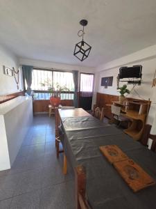 a living room with a table and a dining room at LUSANYUN 1 in Villa Independencia