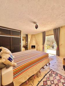 Ένα ή περισσότερα κρεβάτια σε δωμάτιο στο Riad Maj Nia - 5 suites - luxe - Piscine
