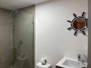 a bathroom with a sink and a glass shower at Stunning 2 Bedroom Apartment in Punta Esmeralda , Costa Rica in Punta Leona +16 photos