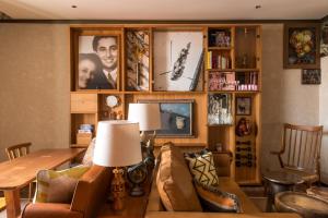a living room with a couch and a table at Brach Madrid - Evok Collection in Madrid
