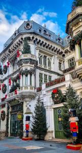 a large white building with christmas decorations on it at Aman 20 in Craiova +20 photos