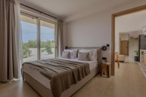 Postel nebo postele na pokoji v ubytování Casa Astra Agia Marina + 51 fotografií