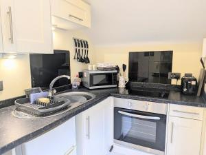 Kuchyň nebo kuchyňský kout v ubytování The Cloisters, Muston