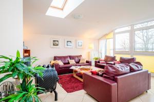 a living room with two couches and a table at Residenz Meeresblick B Fewo 6 in Rerik