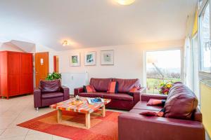 a living room with two couches and a coffee table at Residenz Meeresblick B Fewo 4 in Rerik