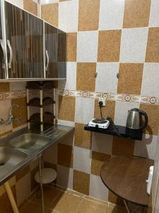 Kuchyň nebo kuchyňský kout v ubytování شقق رجب صالح ضيف الرحمن الزهراني للوحدات المخدومة