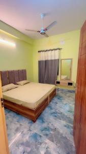 Ένα ή περισσότερα κρεβάτια σε δωμάτιο στο Maharaja hotel and dhaba