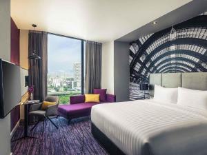 Postel nebo postele na pokoji v ubytování Mercure Bangkok Makkasan